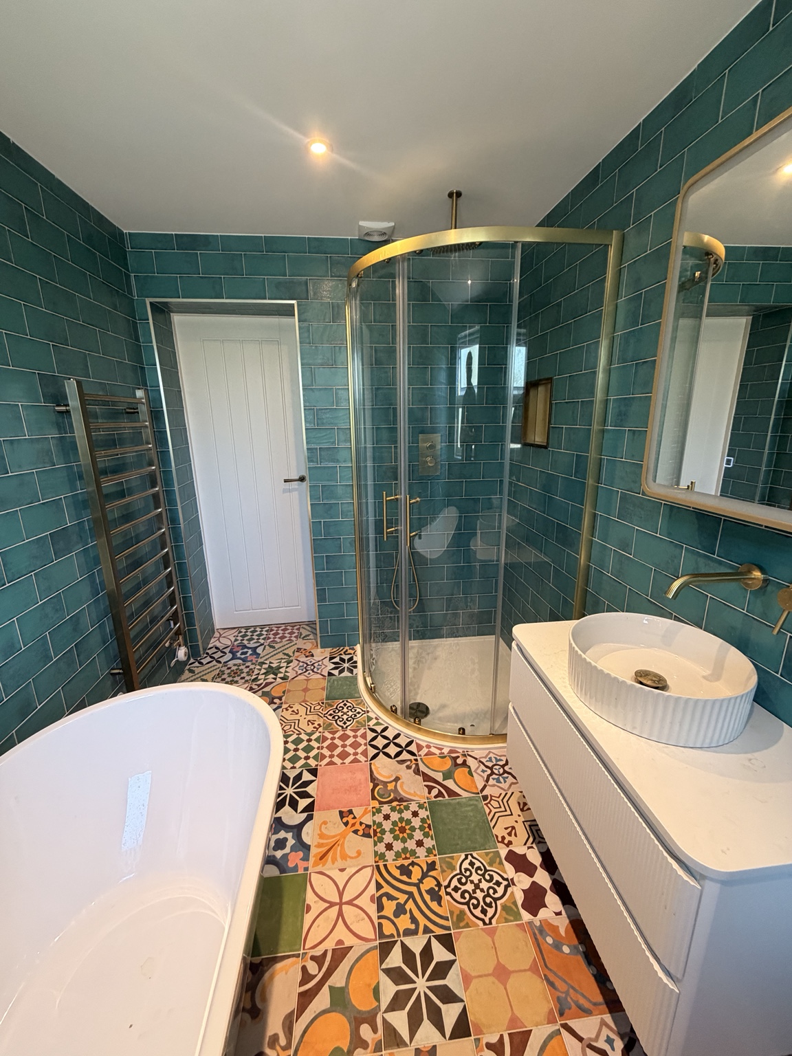 Freestanding bath & teal tiling